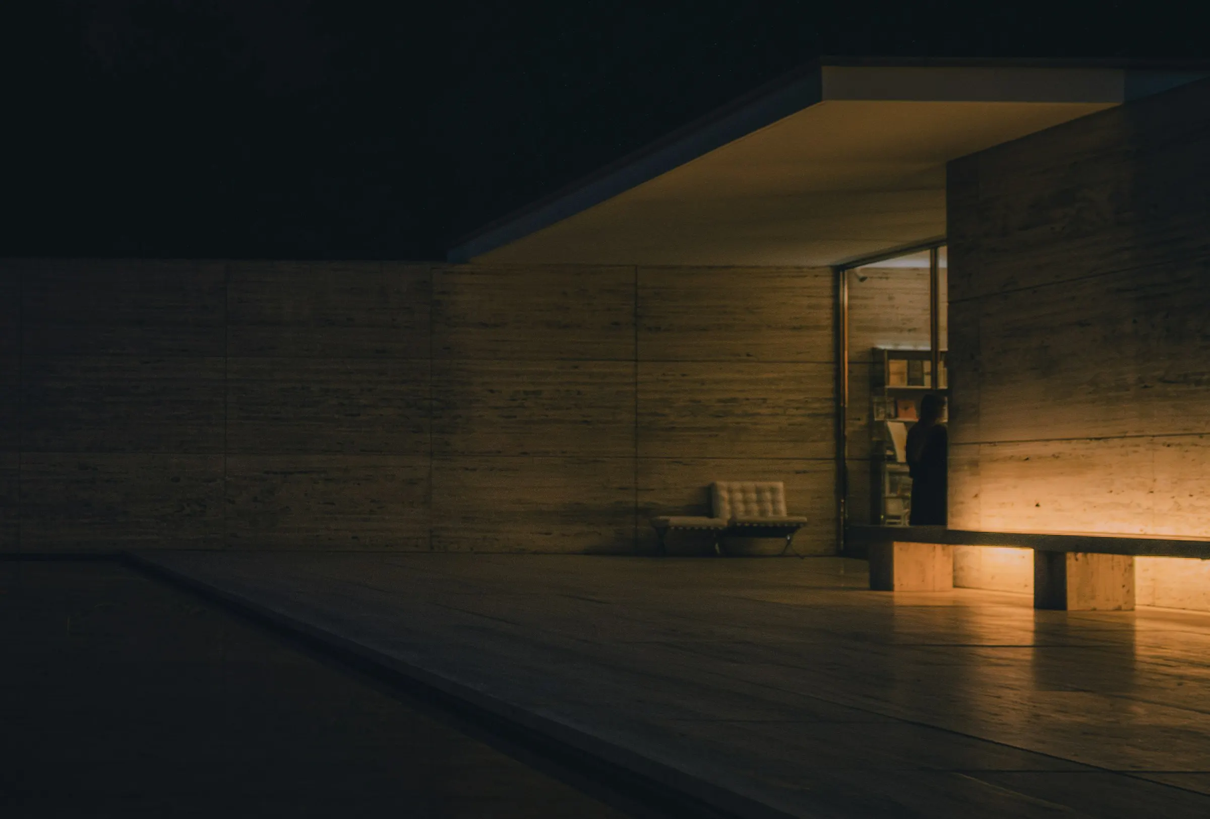 A dark room lit by warm, low light