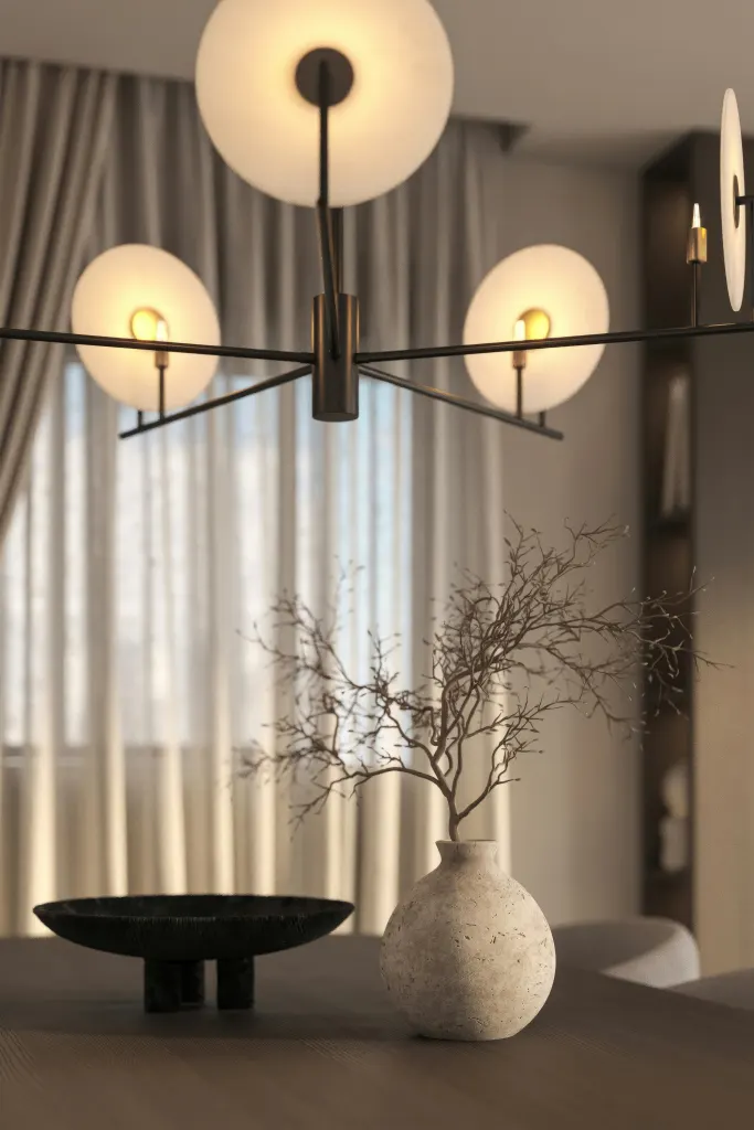 Glass globe lamps above a vase and a stone bowl